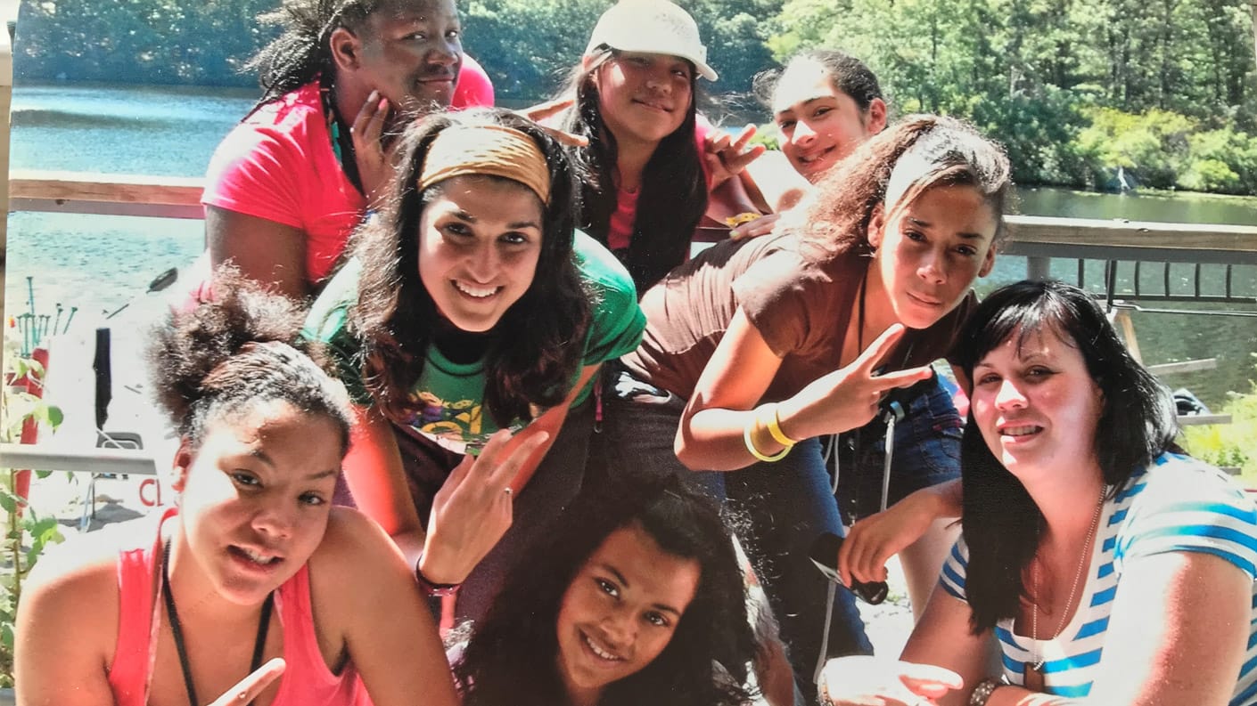 Maria smiling with her friends