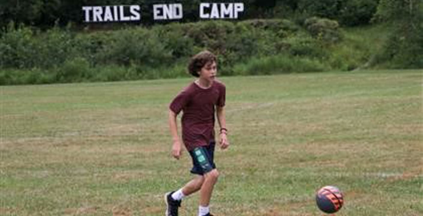 Sam Mullen playing sports at camp