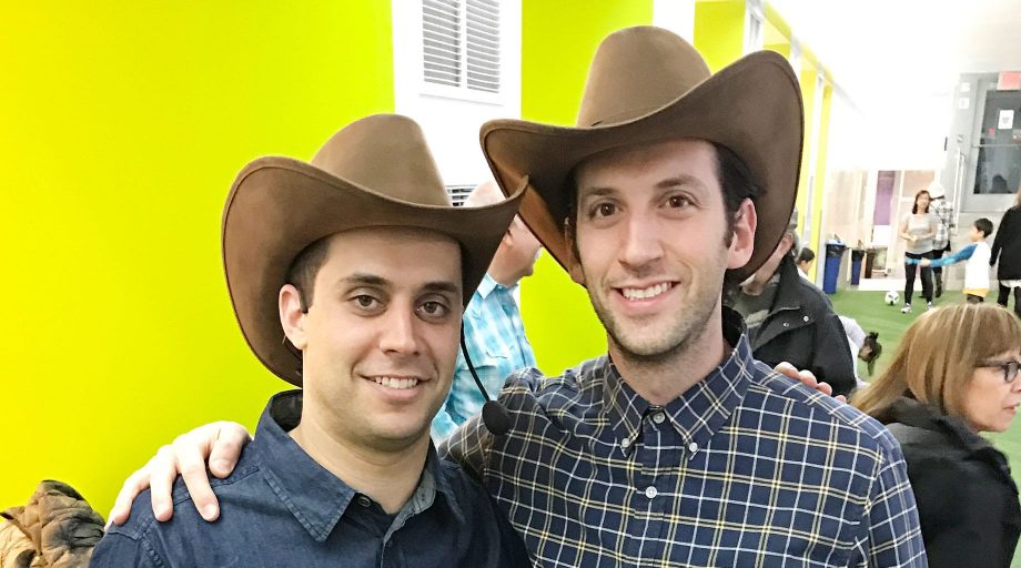 Men wearing cowboy hats at square dance event