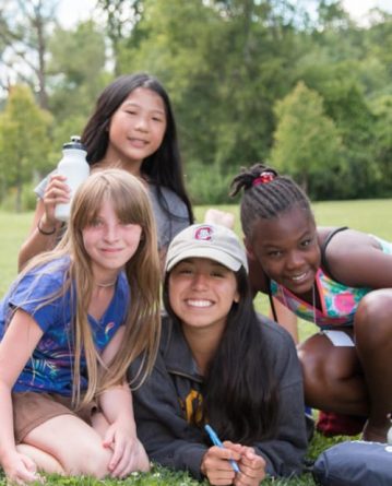 group of girls smiling at summer camp